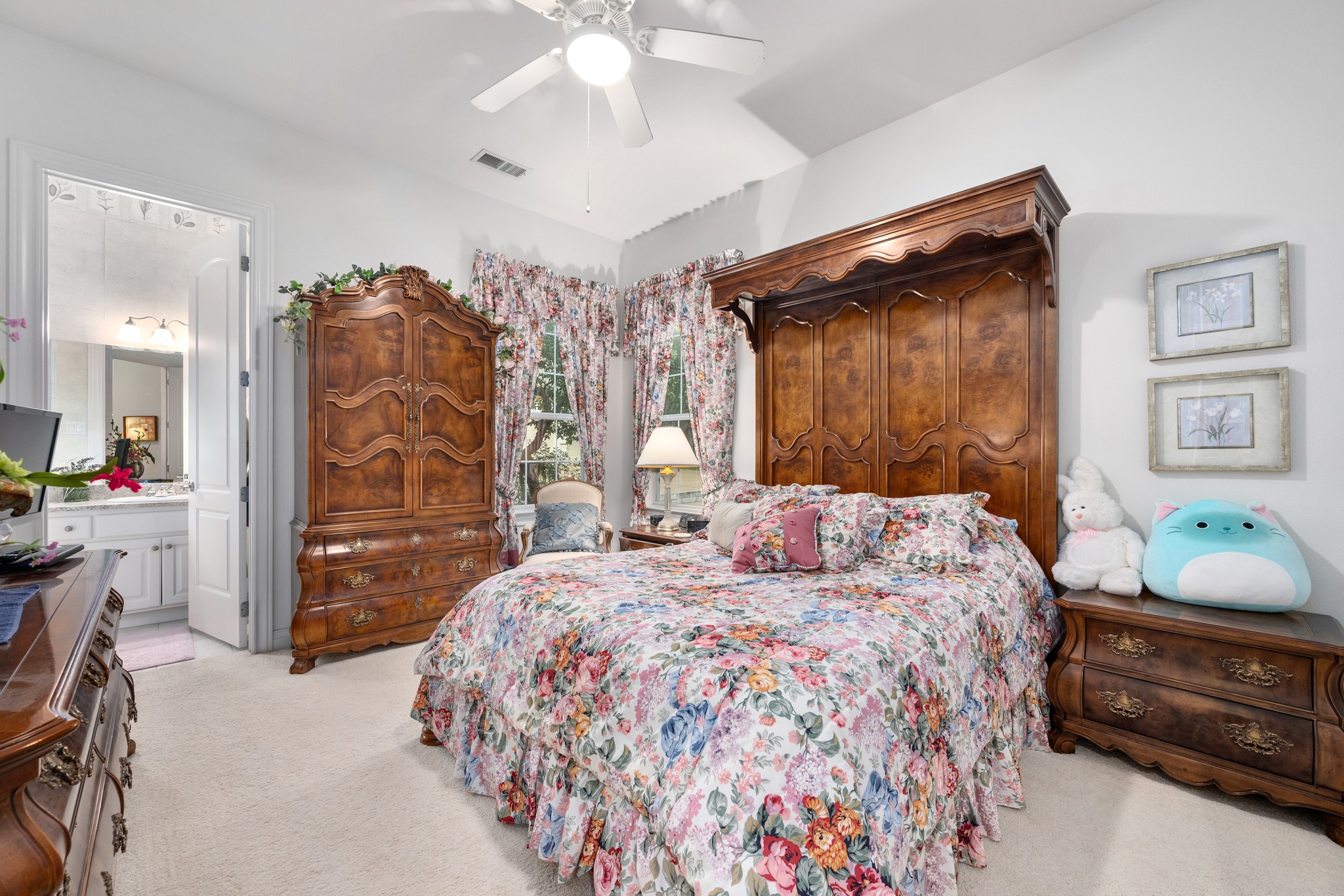 29 Meadows End Georgetown, TX 78628 - Photo 22 of 38 a bedroom with a bed and a chandelier