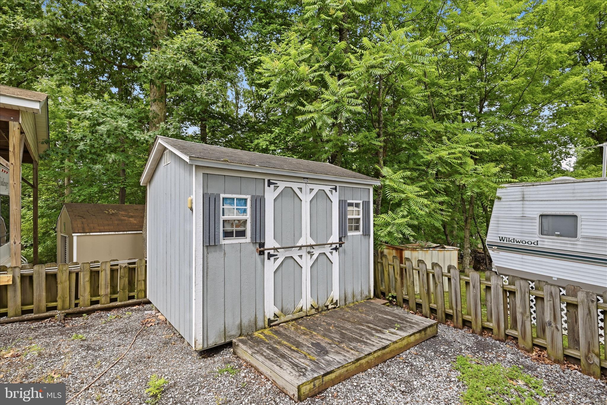Lot 20 Hot Dog Road Falling Waters, WV 25419 - Photo 19 of 26 a view of a small house with wooden fence