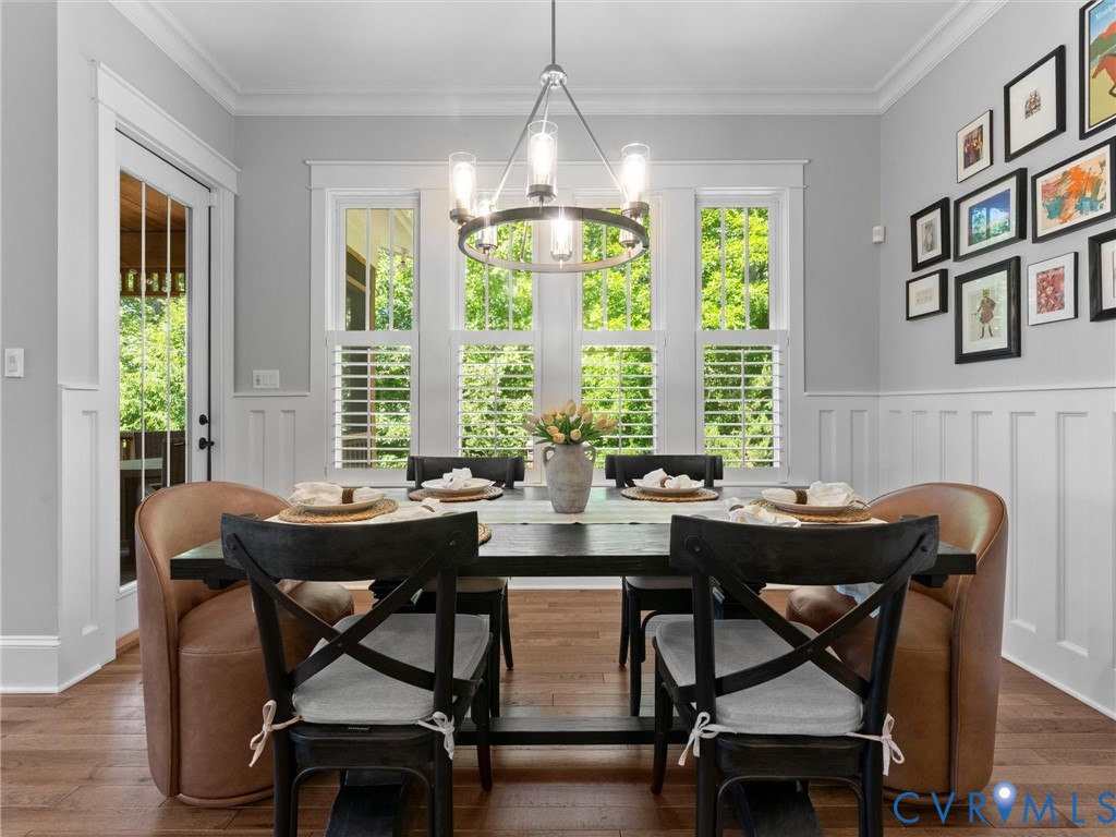 1925 Limbeck Lane Midlothian, VA 23112 - Photo 28 of 89 a dining room with furniture a chandelier and wooden floor