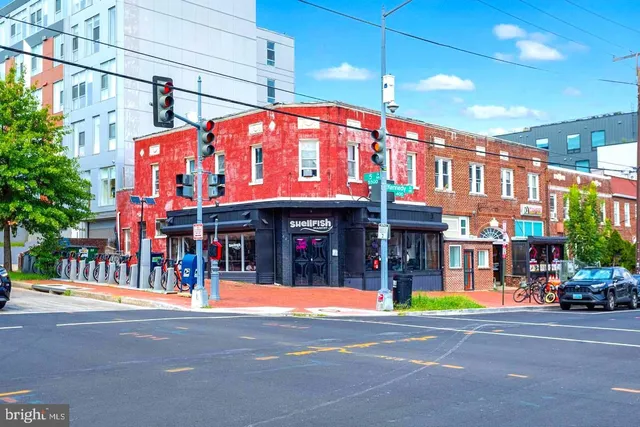 a view of a building with a street