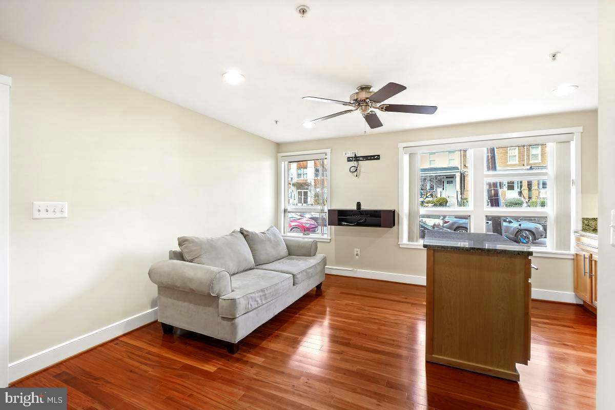 610 Jefferson Street Northwest, Unit 101 Washington, DC 20011 - Photo 7 of 24 a living room with furniture and a large window