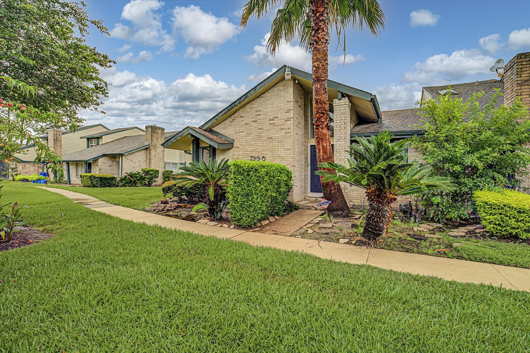 7330 South Dairy Ashford Road Houston, TX 77072 - Photo 2 of 33 a view of a house with a yard and a garden
