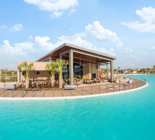an aerial view of a residential building and an outdoor space