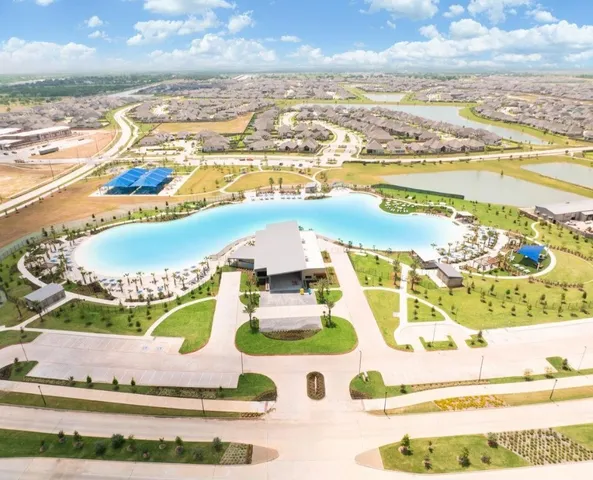 an aerial view of a house with a ocean view