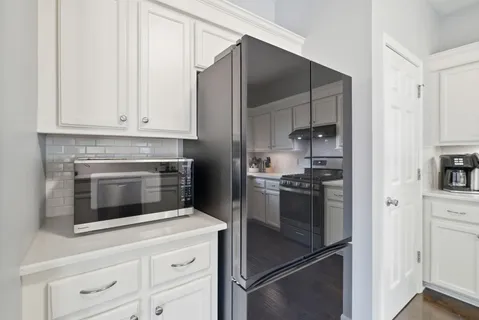 a kitchen with a stove and cabinets