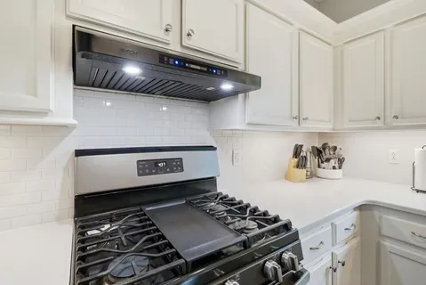 a kitchen with a sink and a window