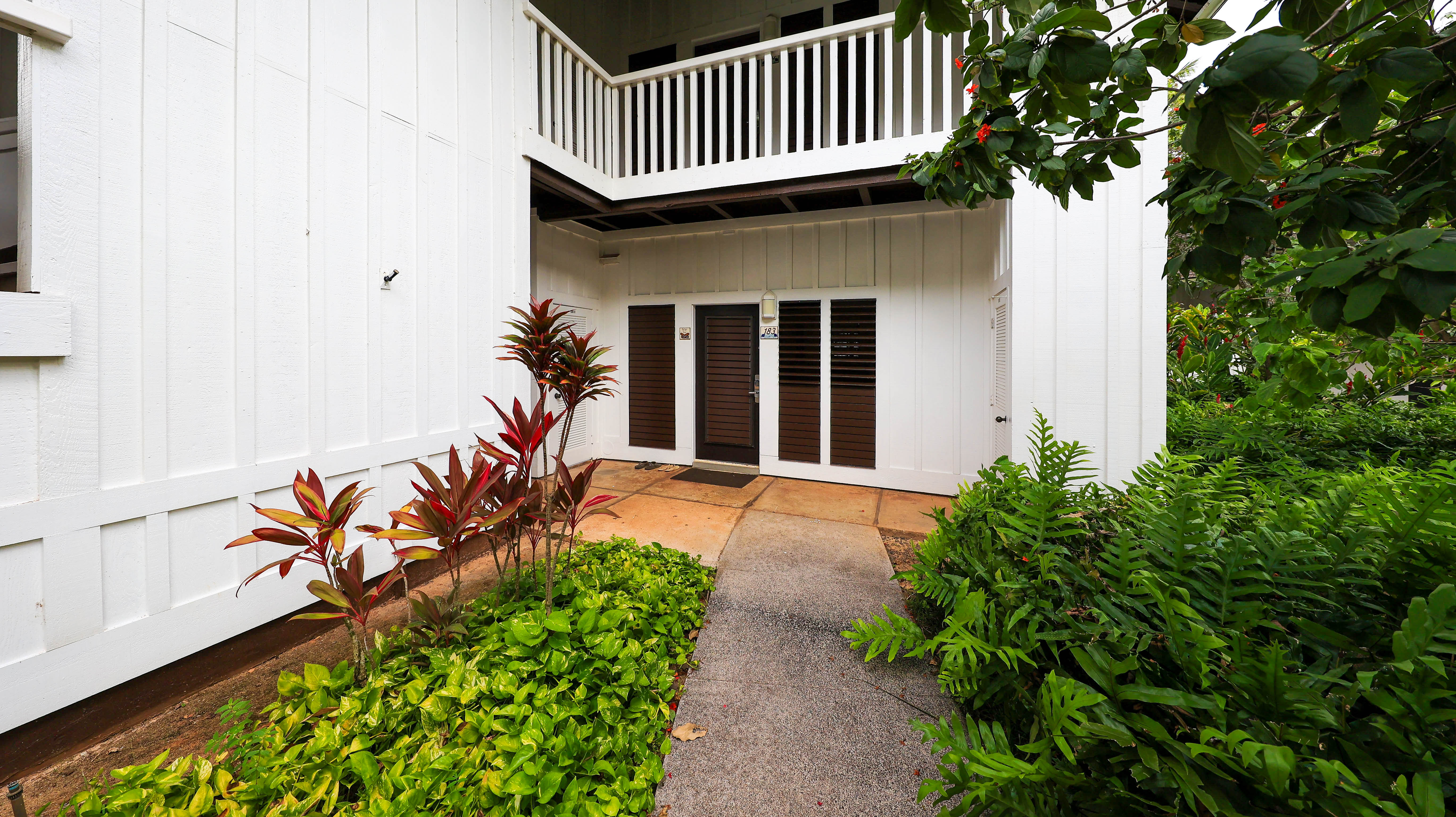 2253 Poipu Road, Unit 183 Koloa, HI 96756 - Photo 14 of 30 a front view of a house with a yard