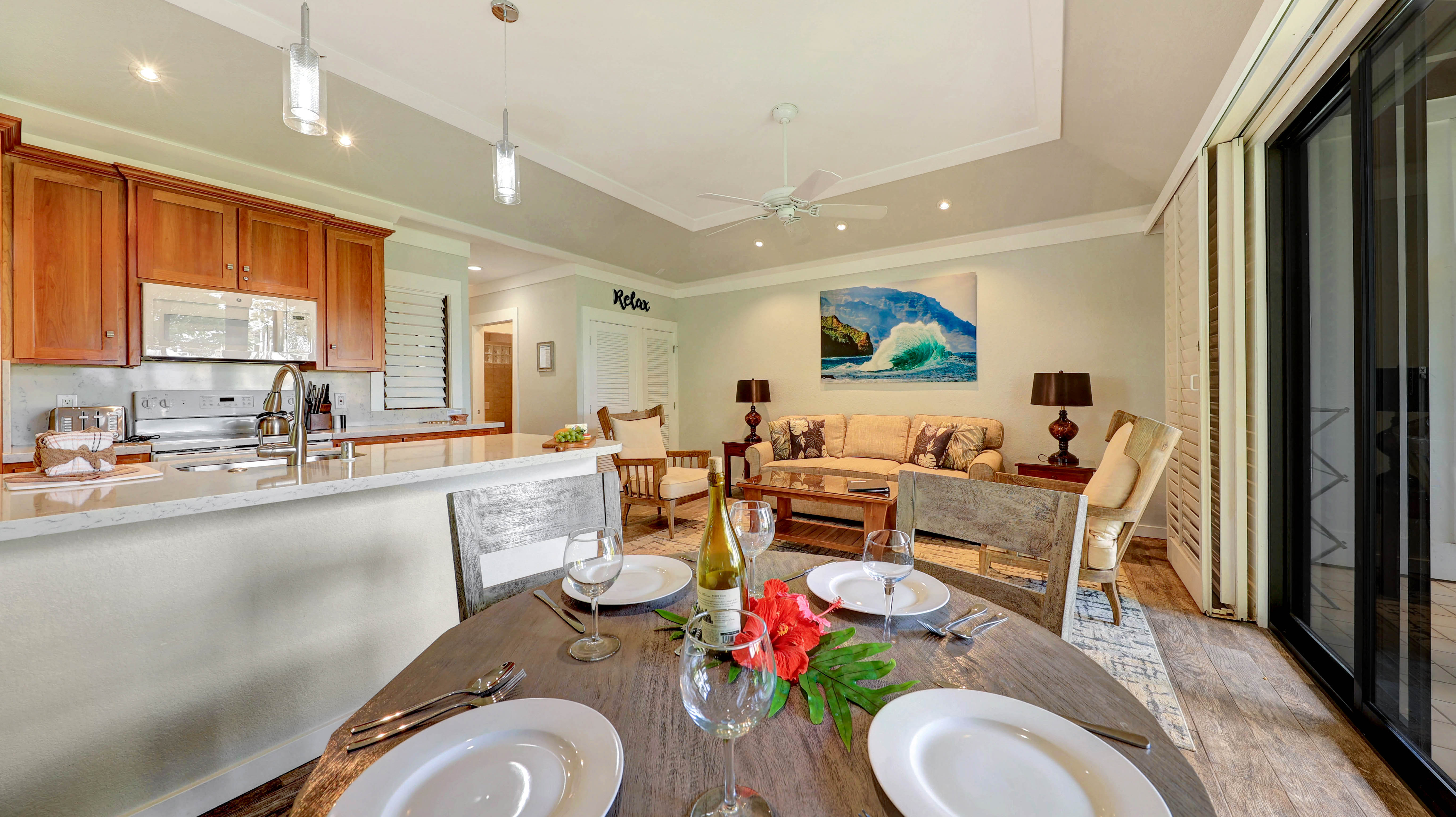 2253 Poipu Road, Unit 183 Koloa, HI 96756 - Photo 17 of 30 a living room with furniture a rug and a large window
