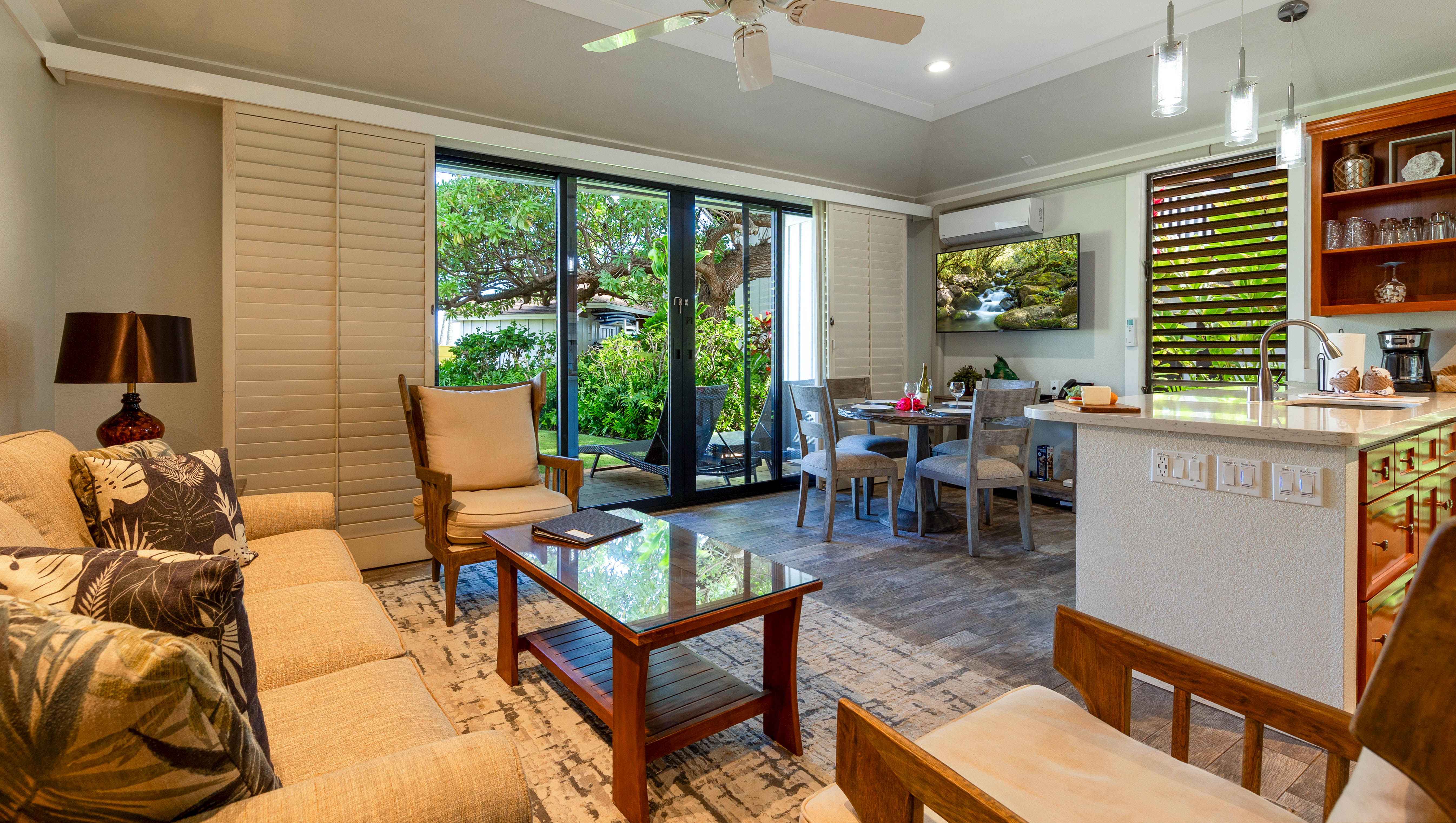 2253 Poipu Road, Unit 183 Koloa, HI 96756 - Photo 18 of 30 a living room with furniture and a floor to ceiling window