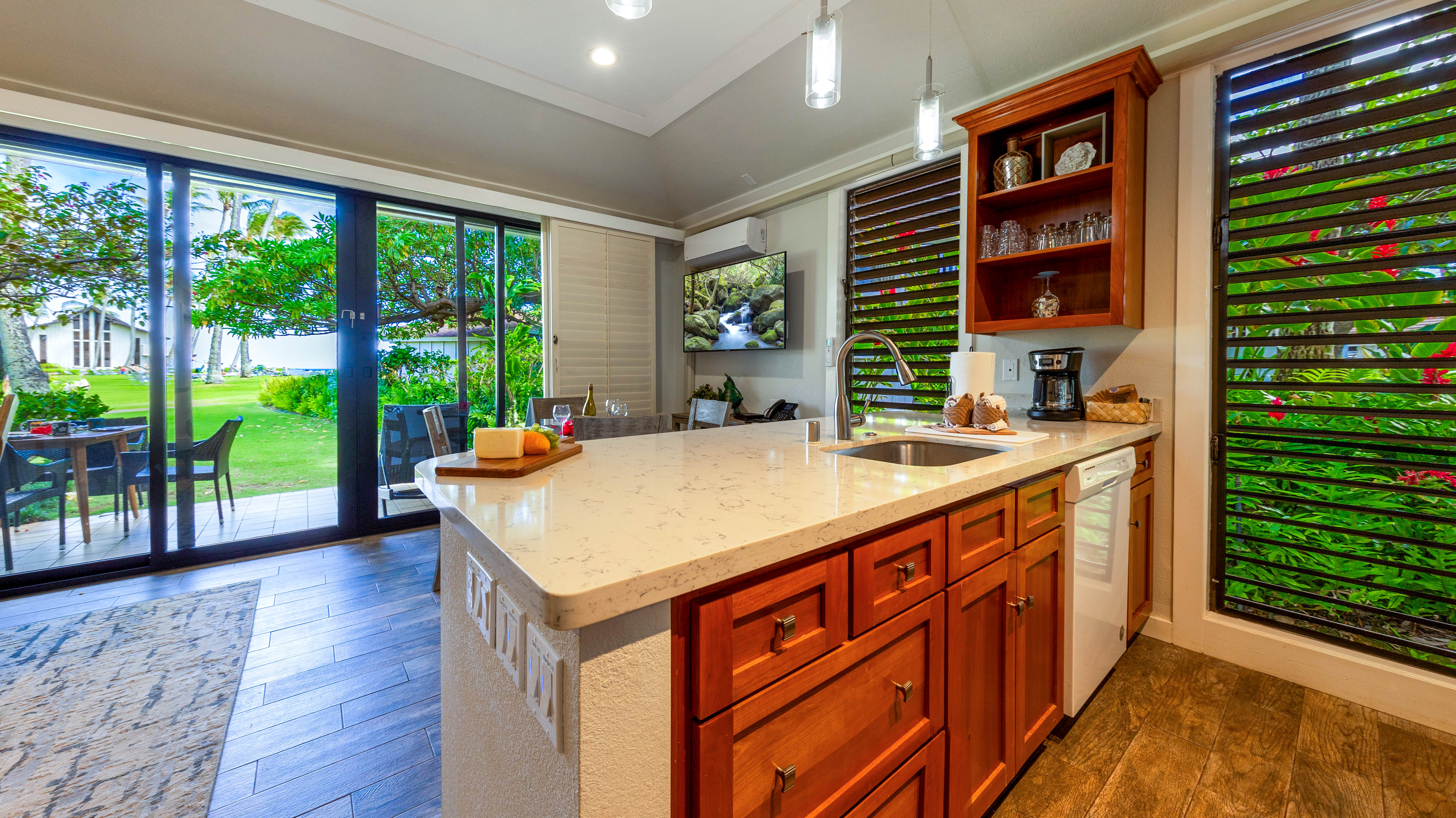 2253 Poipu Road, Unit 183 Koloa, HI 96756 - Photo 25 of 30 a kitchen with a sink and a large window