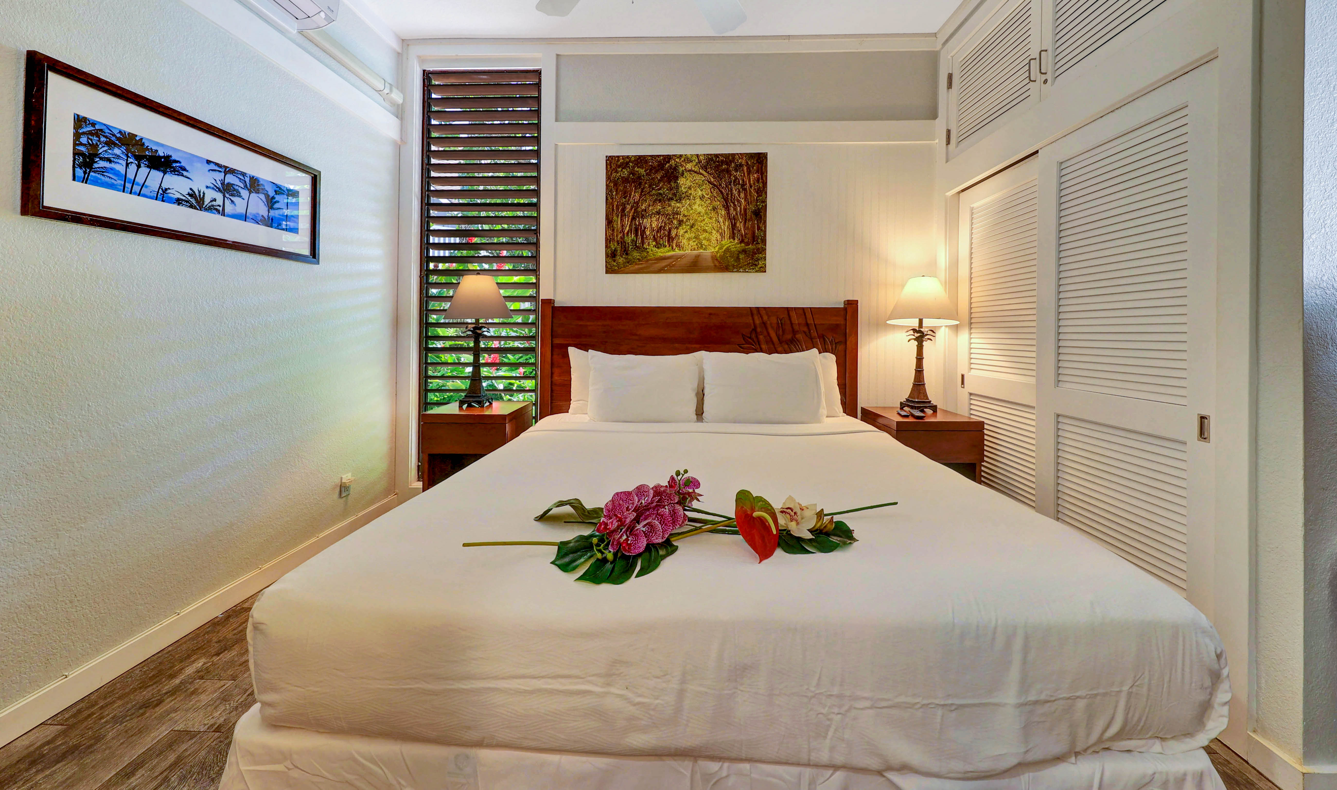 2253 Poipu Road, Unit 183 Koloa, HI 96756 - Photo 28 of 30 a bedroom with a bed and a painting on the wall