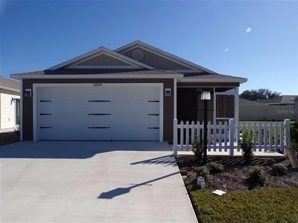 a front view of a house with a garage