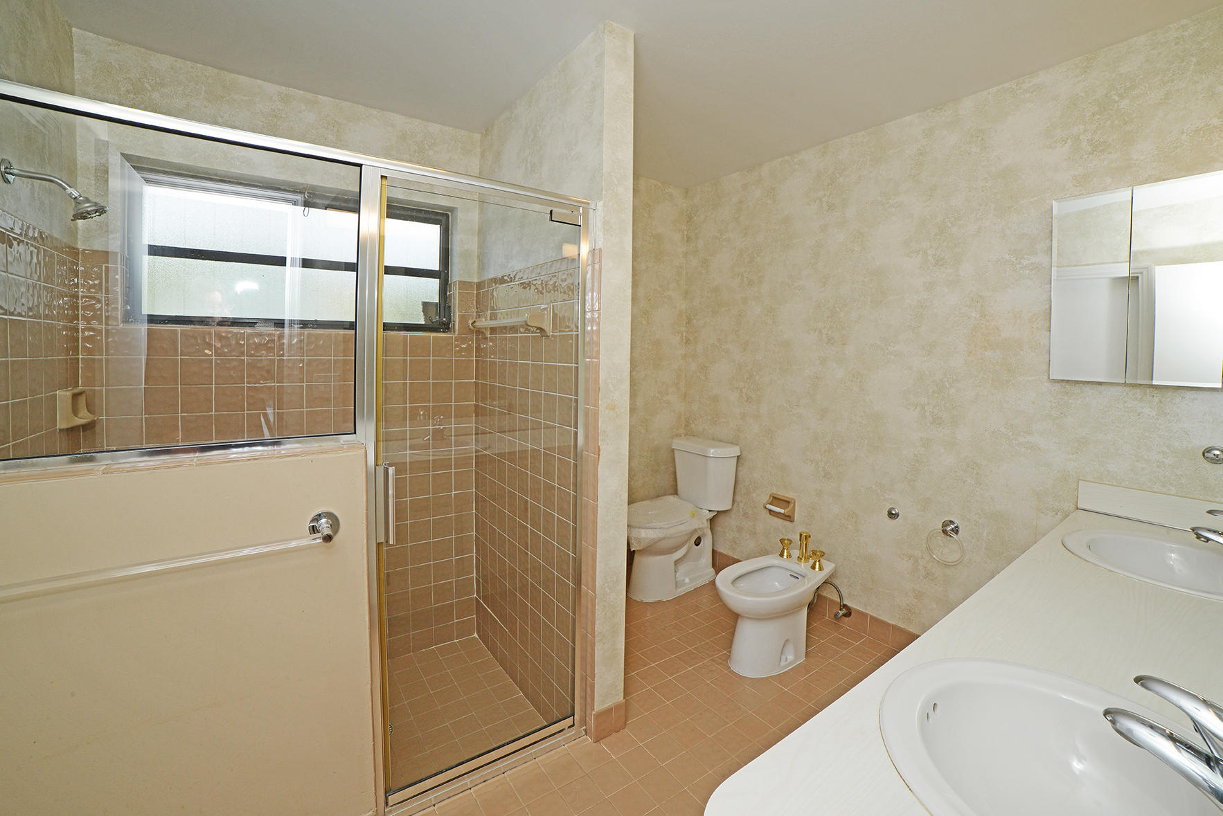 9053 Old Pine Road Boca Raton, FL 33428 - Photo 35 of 42 a bathroom with a toilet sink and shower
