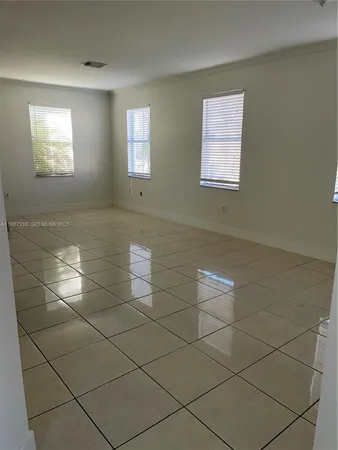 a view of a livingroom and window