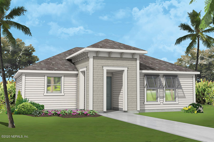 a front view of a house with a garden and plants