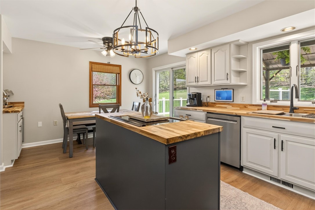 5601 Stuart Avenue Arcadia, NY 14513 - Photo 19 of 50 Kitchen Island with stove top - country chandelier