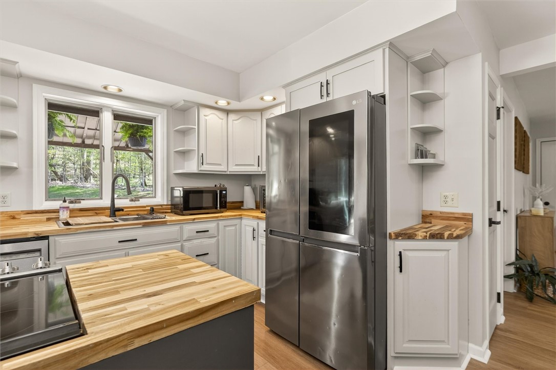 5601 Stuart Avenue Arcadia, NY 14513 - Photo 25 of 50 A bright Cheerful Kitchen with view of the woods
