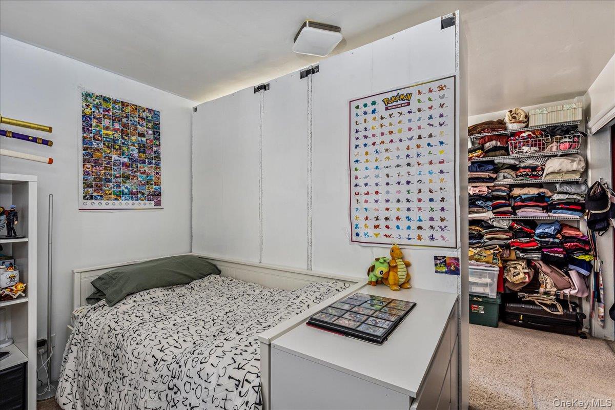 144-55 Melbourne Avenue, Unit 6E Queens, NY 11367 - Photo 14 of 24 Bedroom featuring light carpet