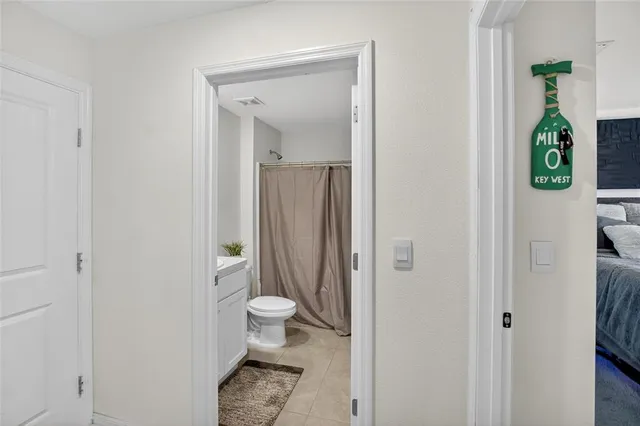 a view of walk in closet with clothes