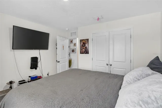 a bed room with a bed and a window