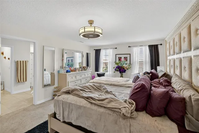 a room with wooden floor and flat screen tv