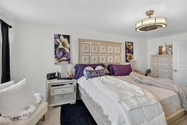 a living room with furniture and book shelf