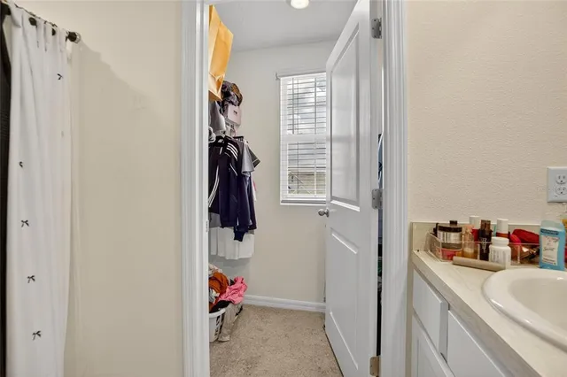 a bedroom with a bed and a table in it