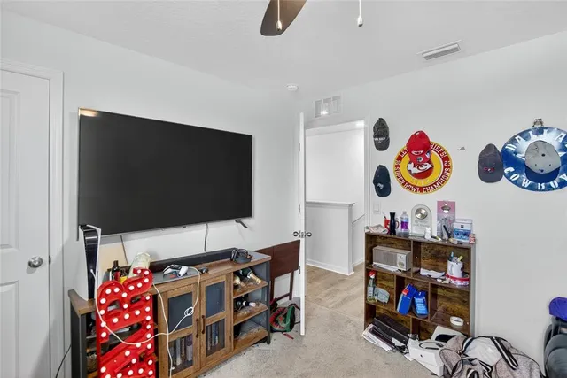 a view of a house with a yard and pathway