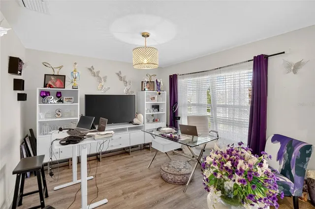 a work room with furniture and a window