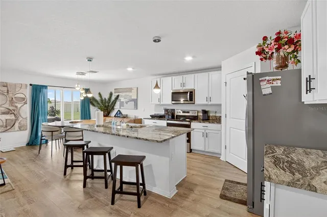 a kitchen with counter space cabinets and appliances