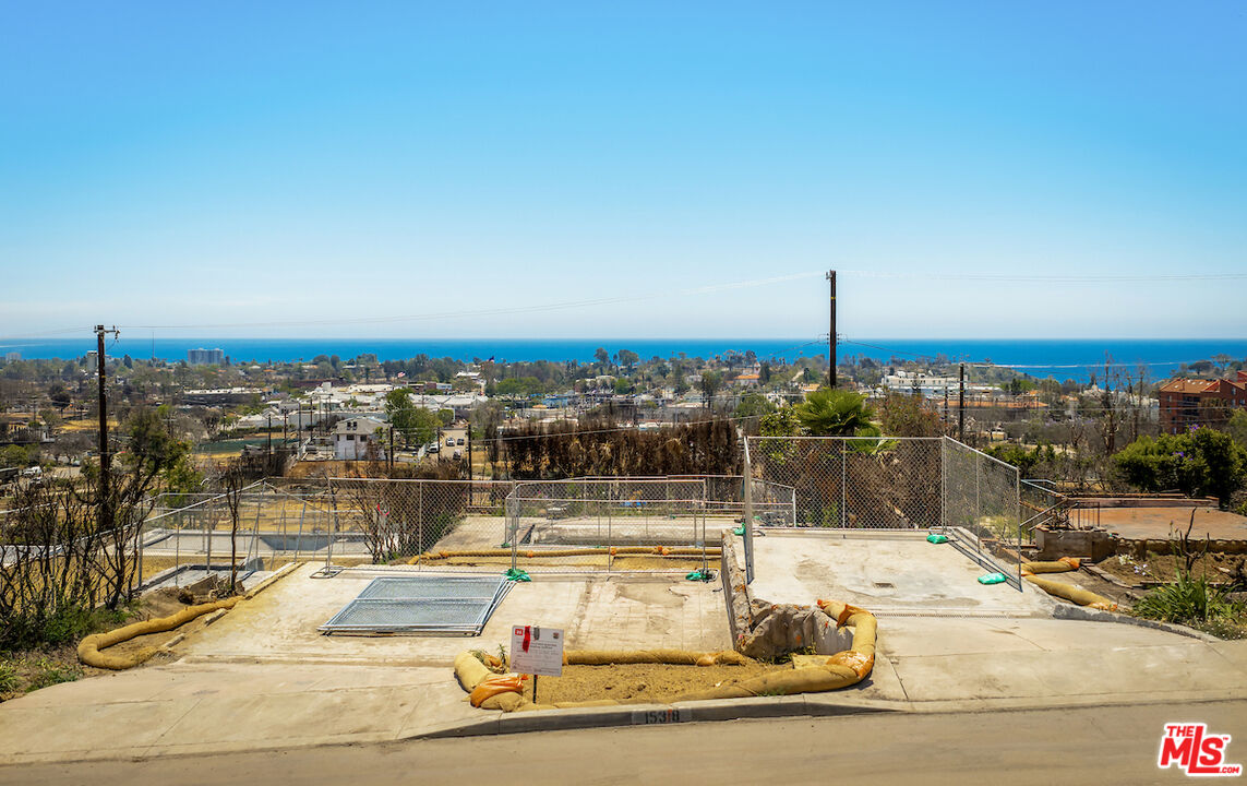 15318 Whitfield Avenue Pacific Palisades, CA 90272 - Photo 1 of 4 a view of a swimming pool with a lake view