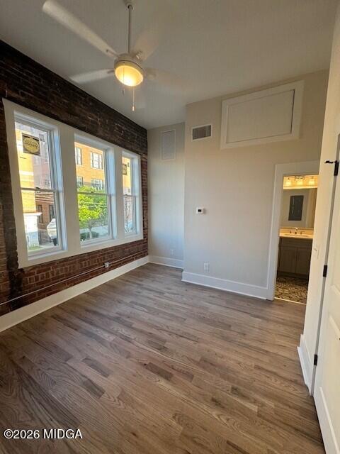 530 2nd Street, Unit B Macon, GA 31201 - Photo 11 of 13 a view of an empty room with wooden floor and a window