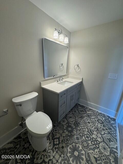 530 2nd Street, Unit B Macon, GA 31201 - Photo 13 of 13 a bathroom with a toilet a sink and mirror