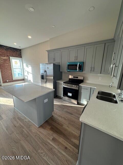 530 2nd Street, Unit B Macon, GA 31201 - Photo 6 of 13 a large kitchen with stainless steel appliances a stove a refrigerator a sink a microwave and cabinets