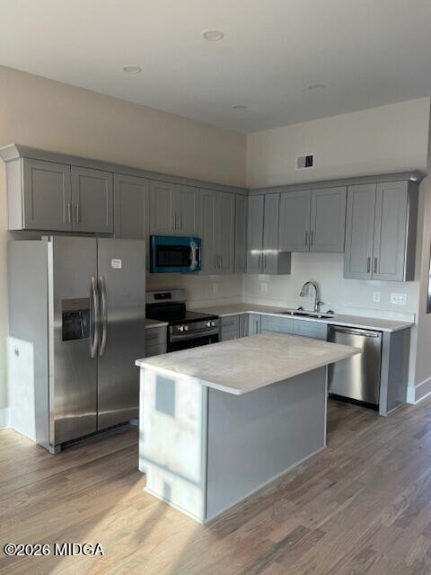 530 2nd Street, Unit B Macon, GA 31201 - Photo 8 of 13 a kitchen with stainless steel appliances granite countertop a sink a stove a refrigerator and cabinets