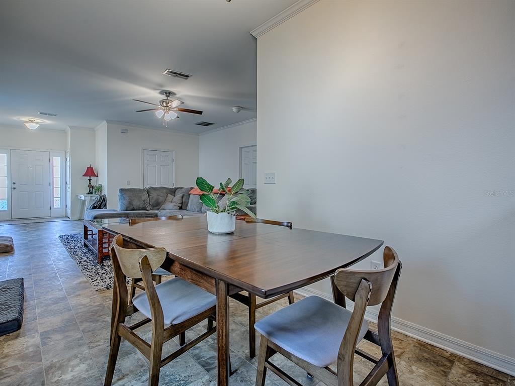 7840 Northwest 21 Way Gainesville, FL 32609 - Photo 13 of 38 a view of a dining room with furniture