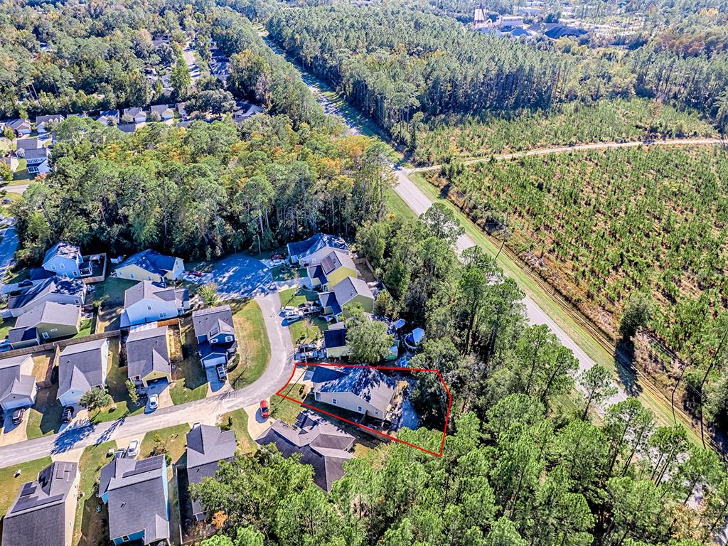 7840 Northwest 21 Way Gainesville, FL 32609 - Photo 34 of 38 an aerial view of residential houses with outdoor space and street view