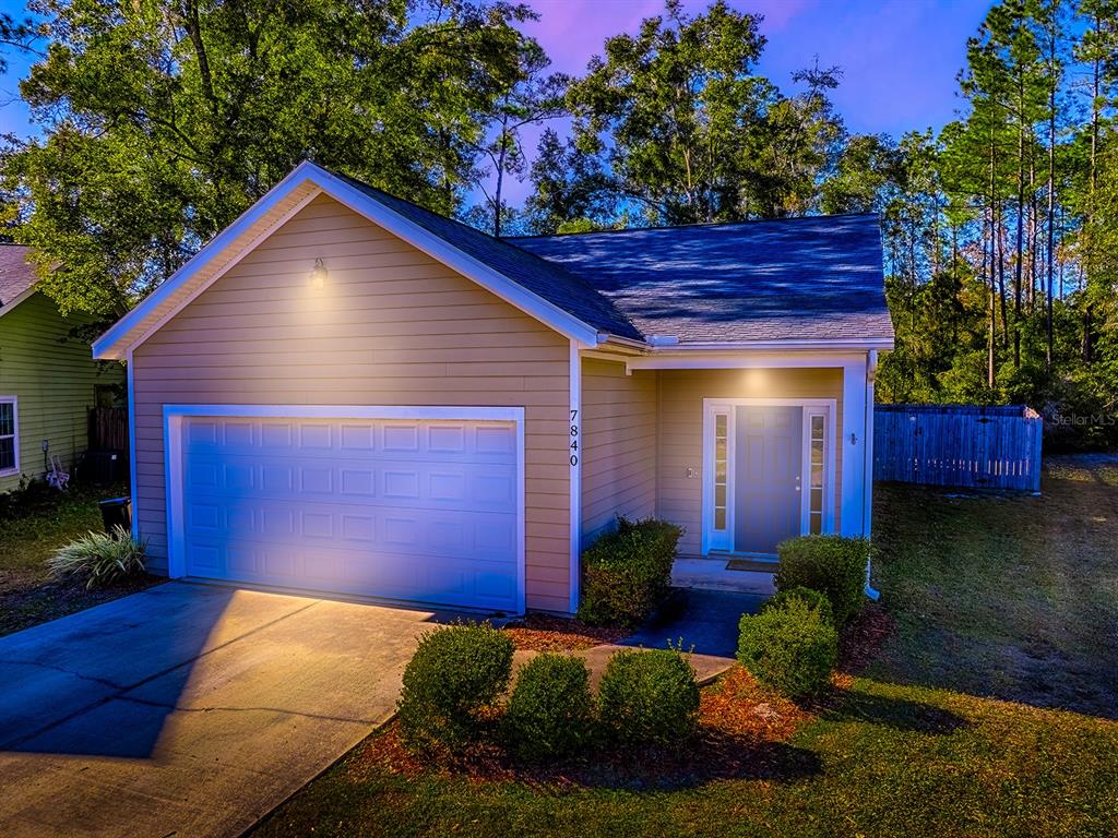7840 Northwest 21 Way Gainesville, FL 32609 - Photo 38 of 38 a house view with a garden space