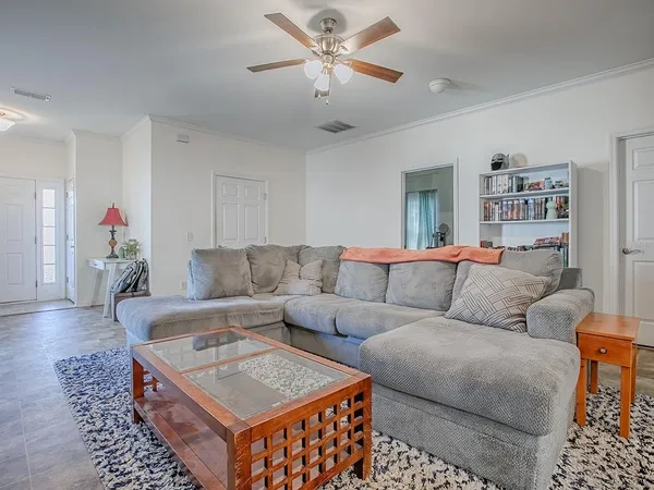 a bedroom with a bed and a television