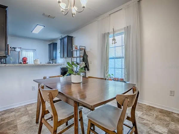 a kitchen with stainless steel appliances granite countertop a refrigerator stove and sink