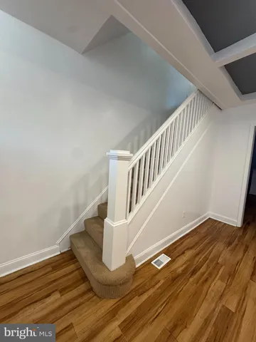 a view of entryway with wooden floor