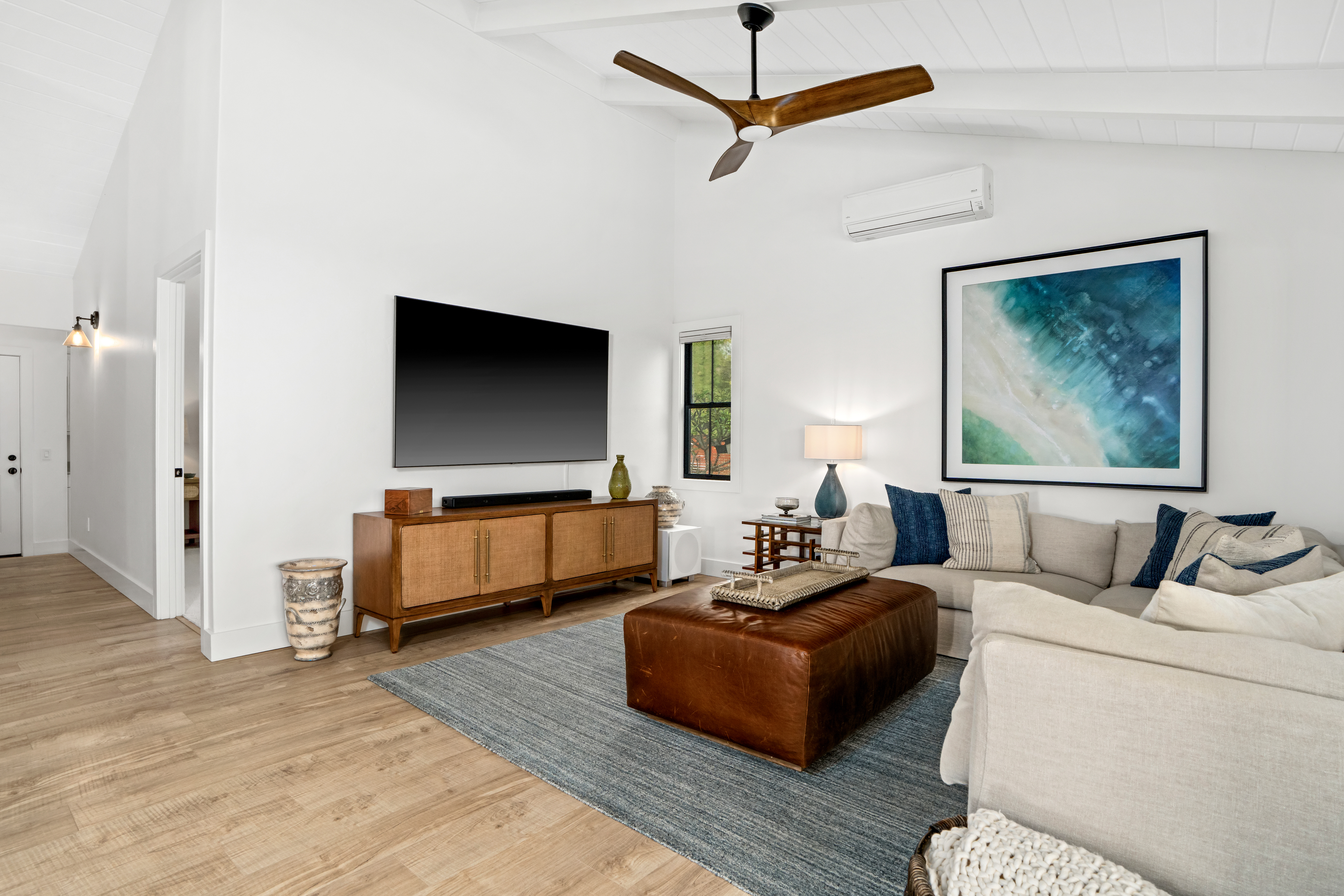 4838 H Puuwai Road, Unit D Kalaheo, HI 96741 - Photo 11 of 25 a living room with furniture and a flat screen tv