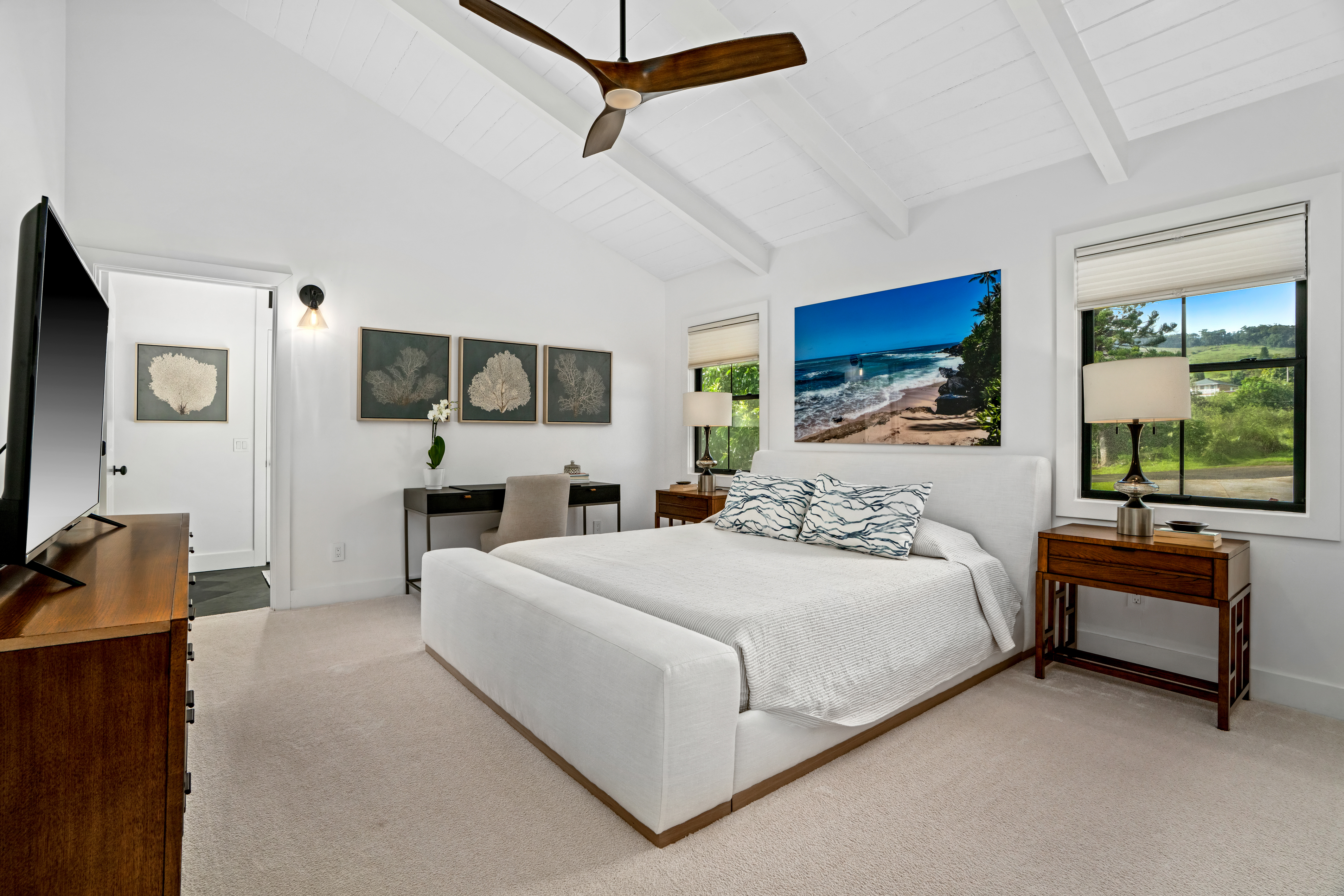 4838 H Puuwai Road, Unit D Kalaheo, HI 96741 - Photo 12 of 25 a bedroom with a bed and a couch