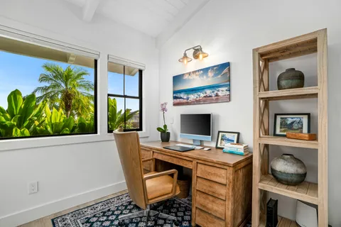 a workspace with furniture and window