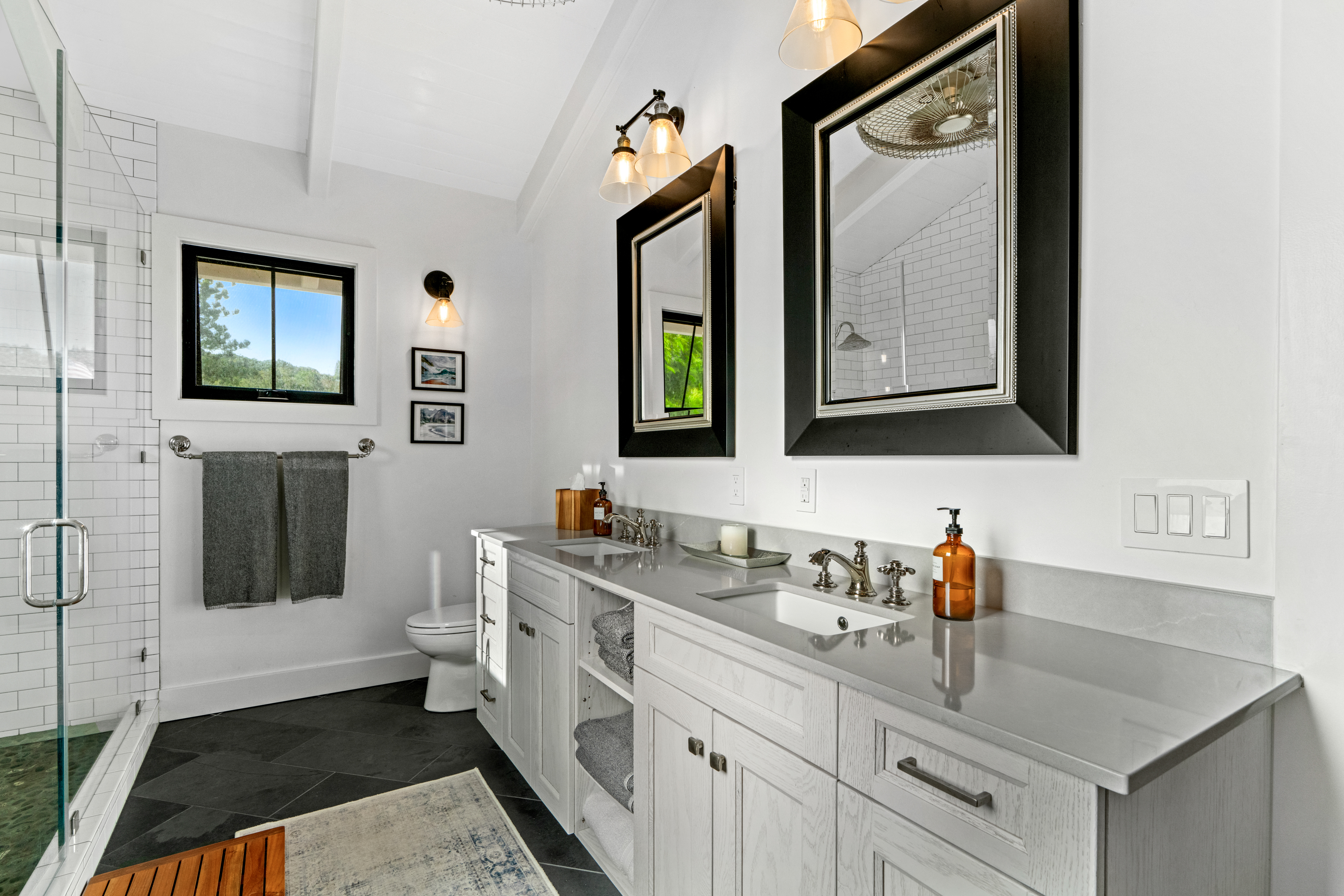 4838 H Puuwai Road, Unit D Kalaheo, HI 96741 - Photo 16 of 25 a bathroom with a toilet sink and mirror