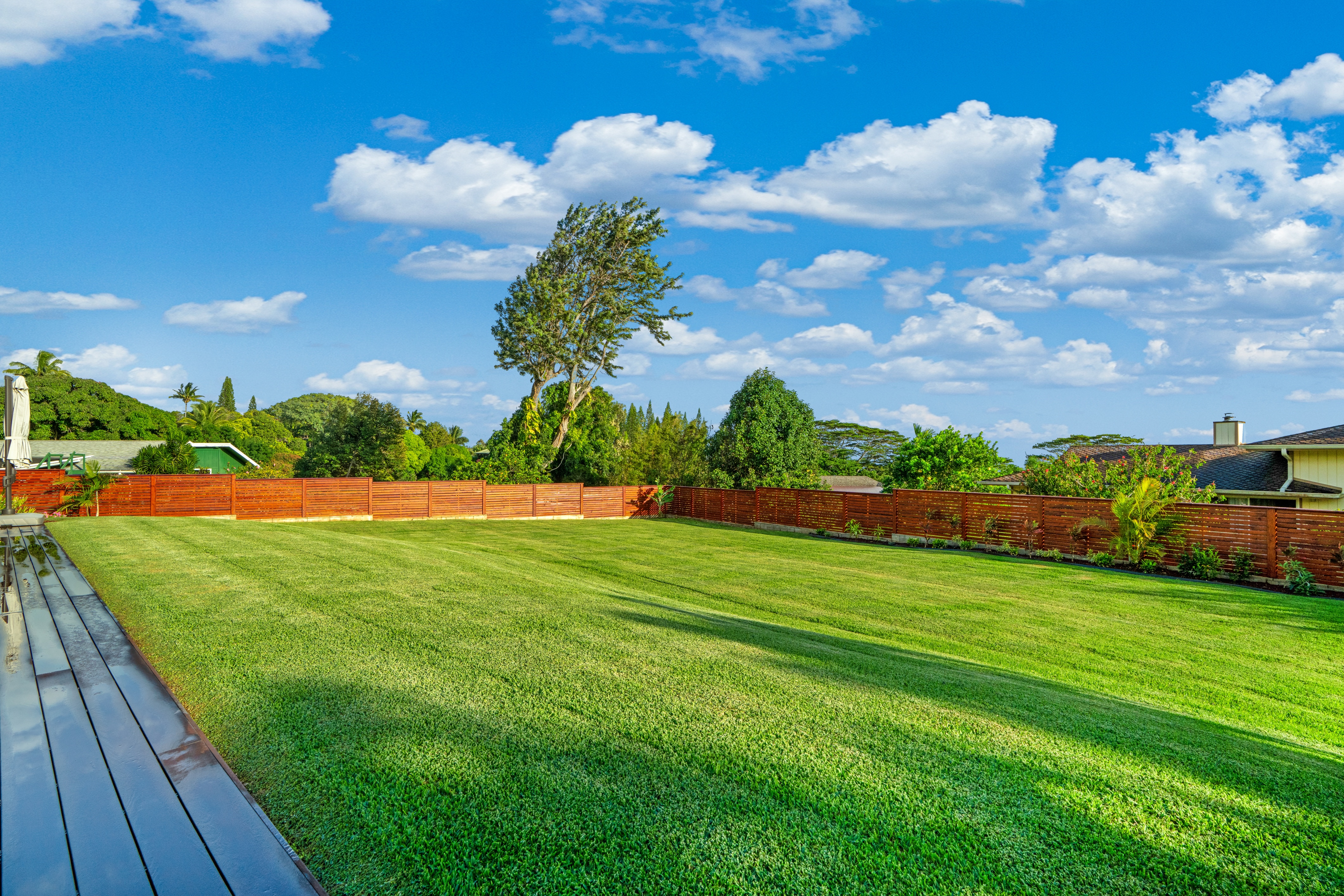 4838 H Puuwai Road, Unit D Kalaheo, HI 96741 - Photo 24 of 25 a view of a golf course with a lake