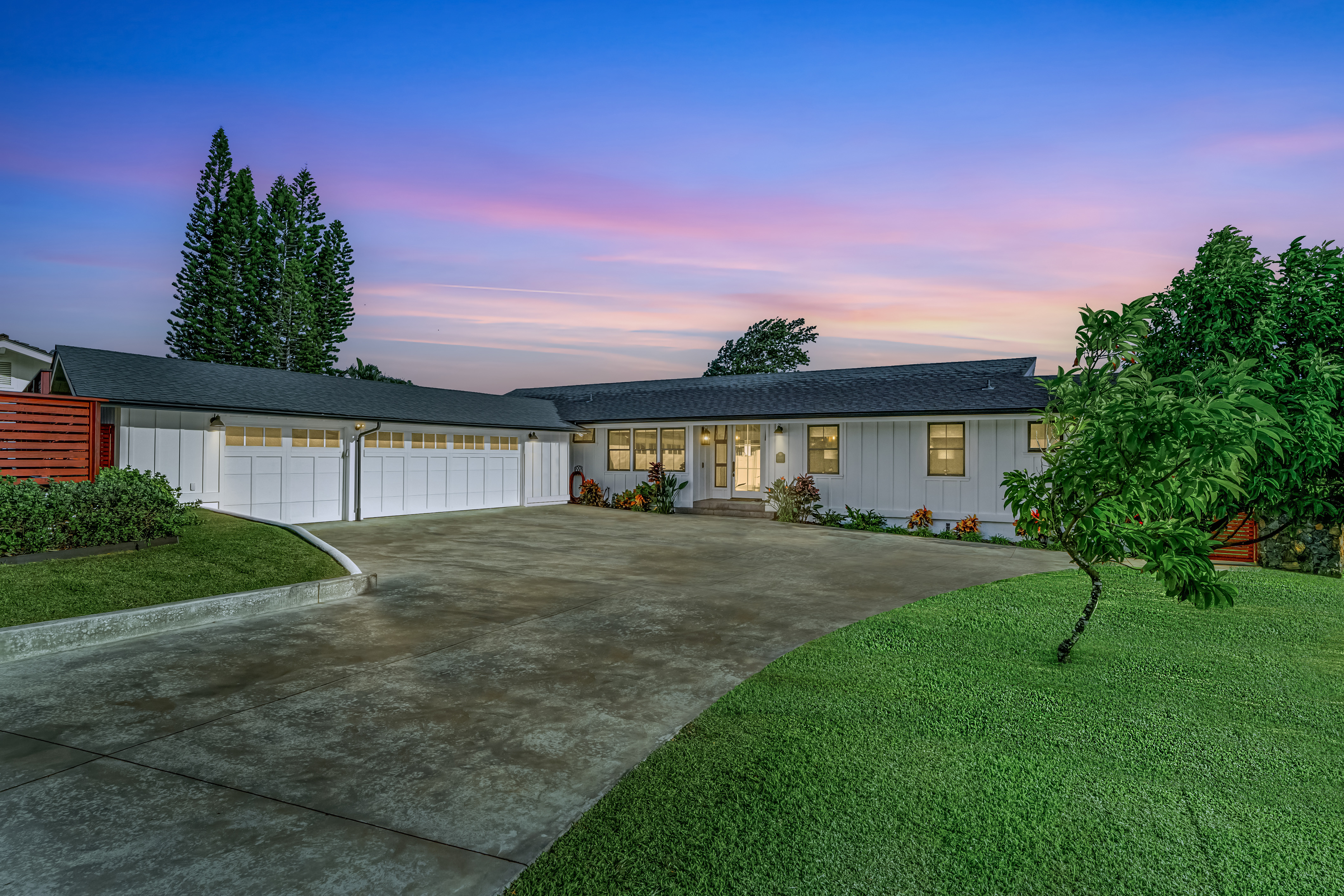 4838 H Puuwai Road, Unit D Kalaheo, HI 96741 - Photo 25 of 25 a front view of a house with a yard and garage