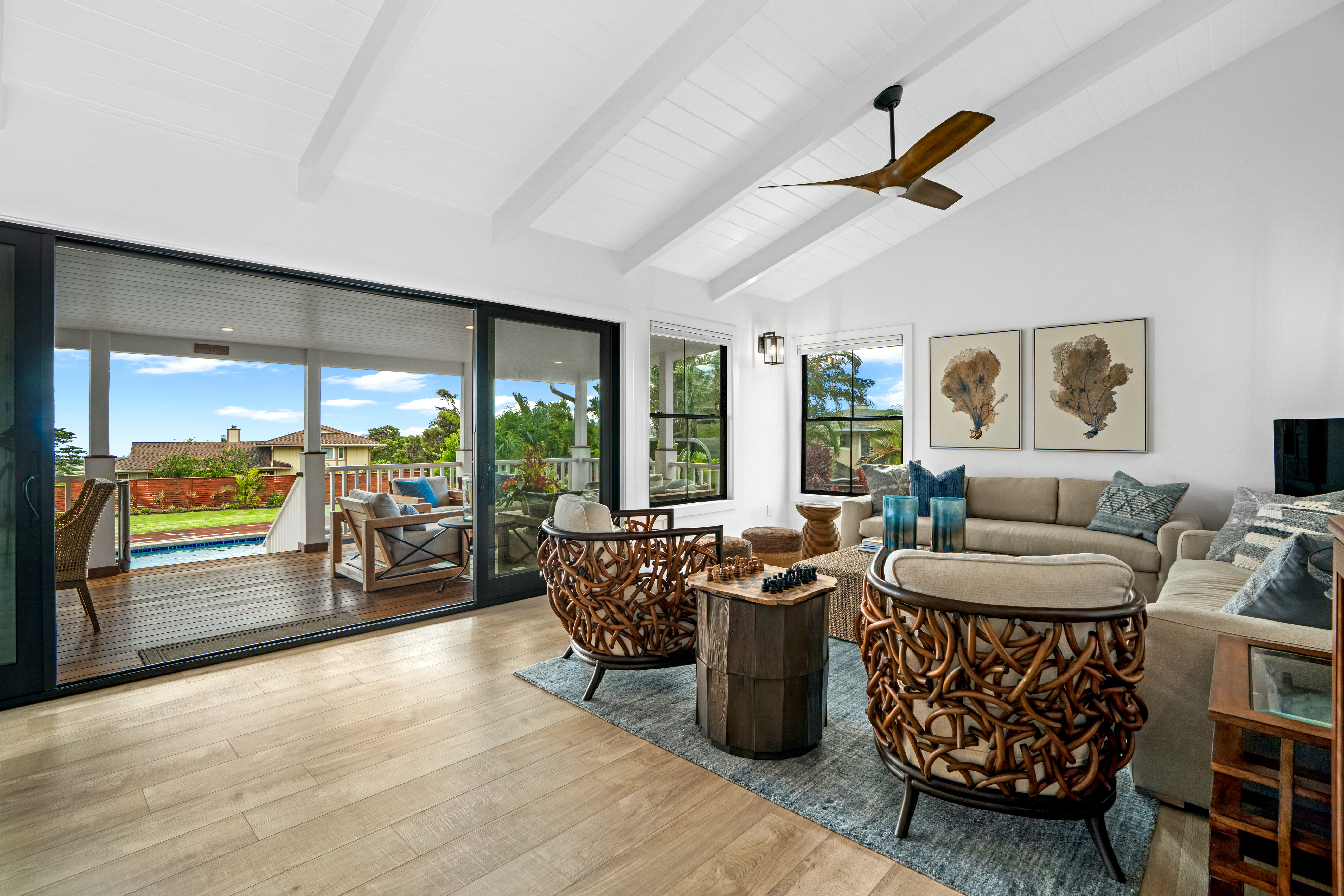 4838 H Puuwai Road, Unit D Kalaheo, HI 96741 - Photo 3 of 25 a living room with furniture and a floor to ceiling window