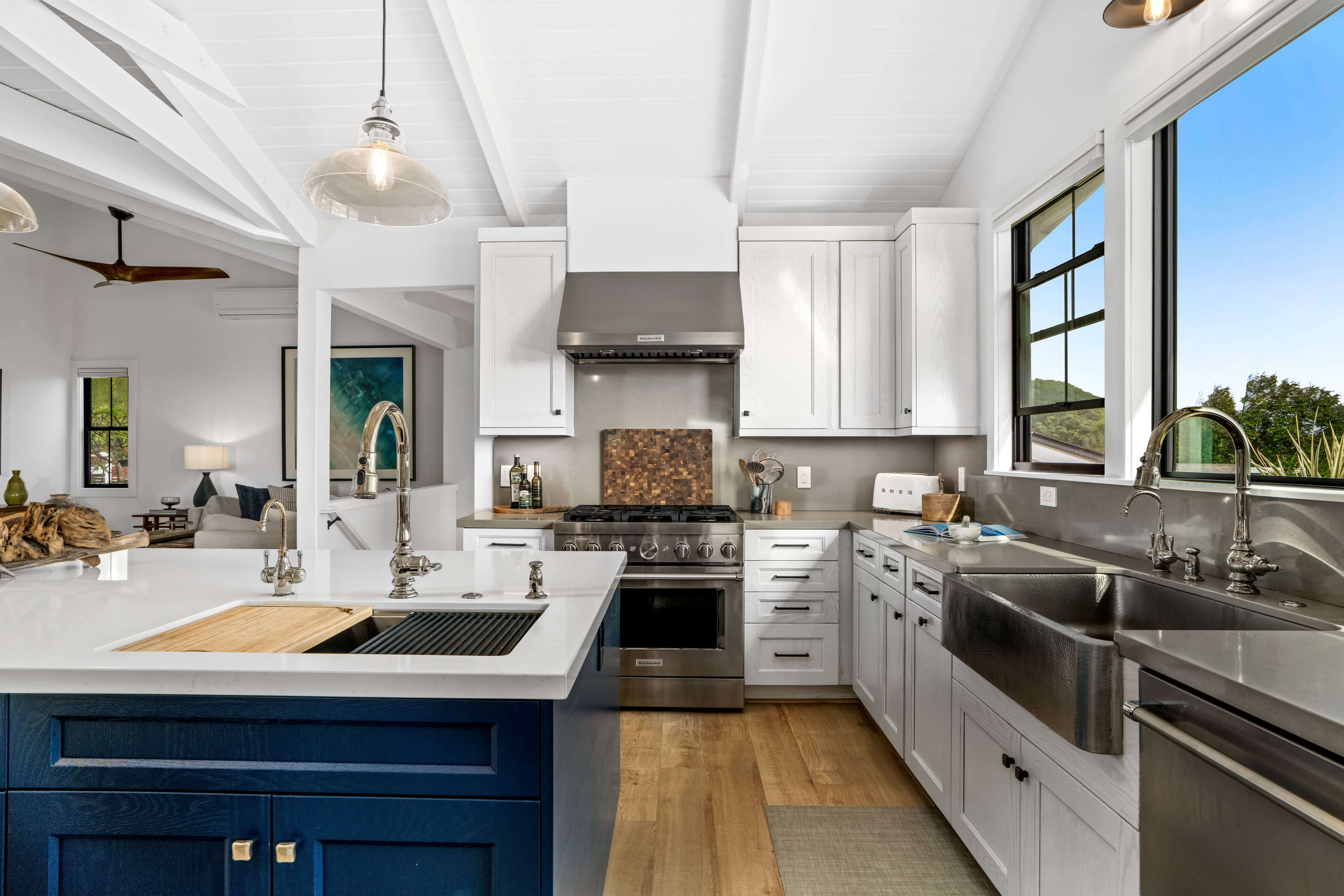 4838 H Puuwai Road, Unit D Kalaheo, HI 96741 - Photo 9 of 25 a kitchen with a sink stove and cabinets