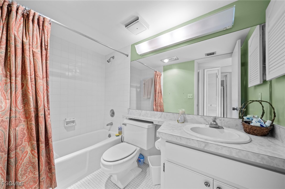 202 Bobolink Way, Unit 202B Naples, FL 34105 - Photo 24 of 31 a bathroom with a granite countertop sink toilet and shower